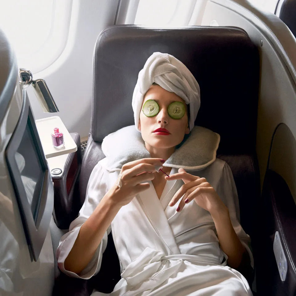 Travel essentials for skincare: Hydrating facial mist, moisturizer, and LED mask for maintaining radiant skin during flights