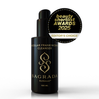A black bottle of Sagrada BioSkincare's Sagrada Micellar Frankincense Cleanser - Deep Cleanser For Delicate Skin, with gold text, stands beside a gold and black "beauty shortlist AWARDS 2025 EDITOR'S CHOICE" badge.