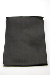 The Sagrada Mulberry Silk Pillowcase by Sagrada BioSkincare, crafted from luxurious dark gray 22-momme silk, pampers your skin and hair while you rest and is known for its thermoregulating properties.