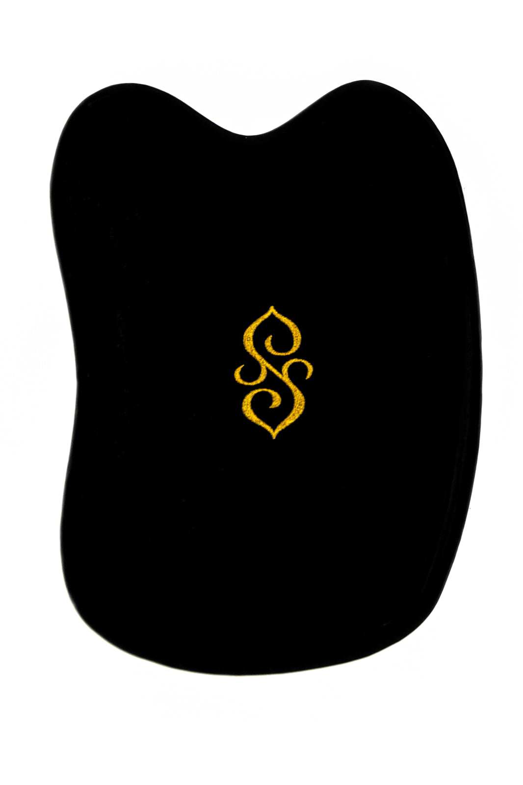 The Sagrada Gua Sha Nephrite Jade by Sagrada BioSkincare is a black, irregularly shaped tool with a gold decorative symbol, inspired by Traditional Chinese Medicine and designed to sculpt, detoxify, and revitalize your skin.