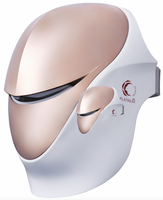 The CELLRETURN Platinum MD by Adverto Beauty is a white and rose-gold LED mask with a sleek visor and "PLATINUM" logo on the side, designed for advanced wrinkle repair and skin rejuvenation.