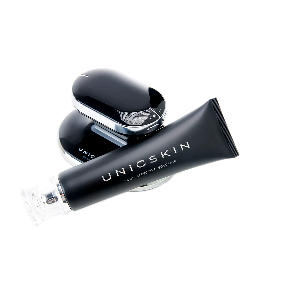 A sleek black tube labeled "Adverto Beauty UNICBODY Slim Action x4 - High Tech Multi-Action Body Contour & Shaping Cream" rests in front of a shiny, oval-shaped beauty device, both displayed on a white background.