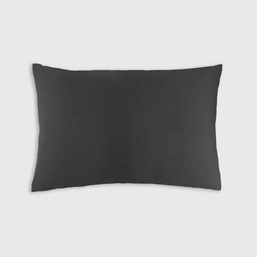The Sagrada Mulberry Silk Pillowcase by Sagrada BioSkincare, shown in black against a light gray background, highlights its luxurious 22-momme silk texture and thermoregulating benefits for skin and hair while you rest.
