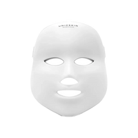 The UNICskin Korean LED Mask by Unic Skin features a white, expressionless design with eye, nose, and mouth openings. “UNICSKIN” is printed on the forehead, making it a standout skincare device for acne, hyperpigmentation, and aging.